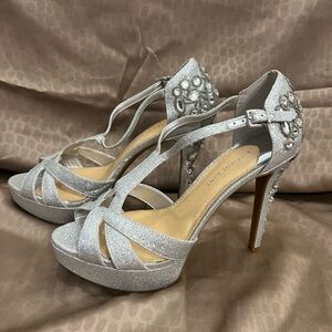 Silver with rhinestone embellishments. High heels shoes. Gianni Bini